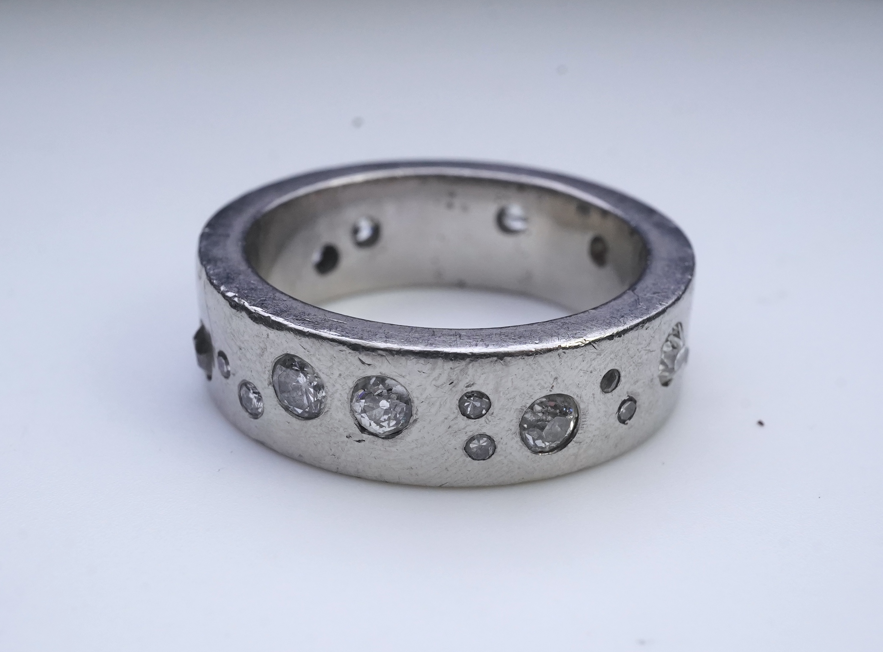 A platinum and diamond eternity ring